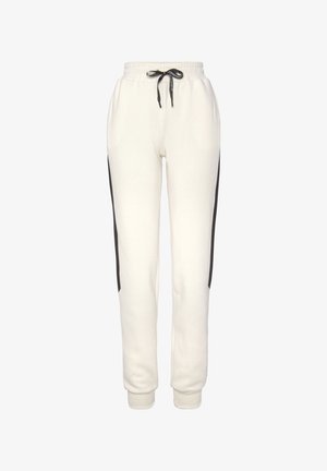 White sweatpants with black side stripes, elastic waistband with drawstring, and cuffed ankles. Made from a soft, breathable material.