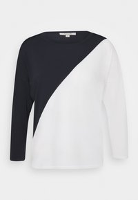 Maglietta a maniche lunghe bianco e nero con design a spacco diagonale, realizzata in morbido tessuto con scollatura rotonda e vestibilità rilassata.