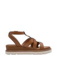 Brown leather sandals with cross straps, a padded insole, and a thick white sole. Features a back ankle strap with a gold buckle accent.