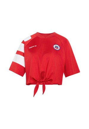 Maglia sportiva rossa corta con righe bianche sulla manica sinistra, logo Adidas, stemma della squadra del Cile e dettaglio con laccio frontale.
