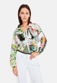Colorful, zip-up jacket with a tropical pattern. Made from lightweight fabric, it features a high collar and elasticized cuffs and hem.