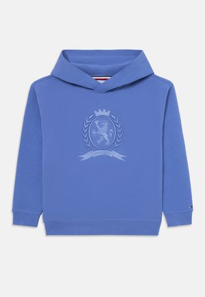 Blå sweatshirt med huva, med en broderad emblemdesign i mitten, textil med struktur, samt ribbade manschetter och nederkant.