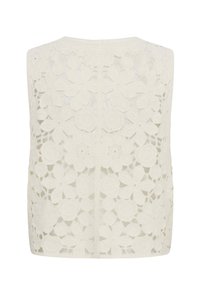 Sleeveless white crochet vest with floral pattern, featuring large and small flowers and leaves, open weave design.