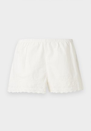 Shorts blancs en coton avec taille élastique et ourlet festonné avec un détail de broderie florale ajourée.