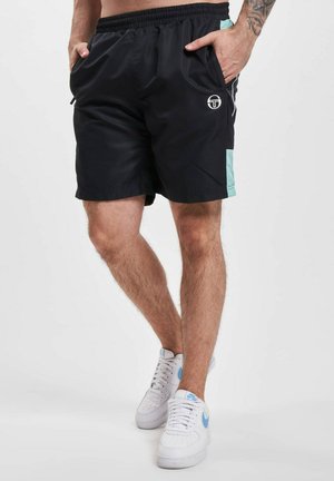 Svart svømmebukser med elastisk midje, sidelommer og lyseblå detaljer. Har et logo på forsiden.