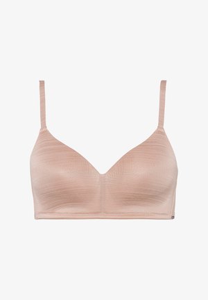 Wireless bra in light beige, featuring a smooth texture, V-neck design, and thin adjustable straps. No padding or underwire.