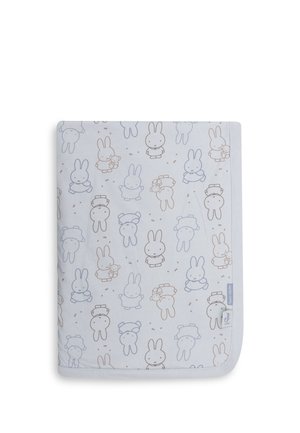 Baby blanket with a pattern of simple, outlined bunny characters in soft blue and beige on a light background, folded neatly with a label visible.
