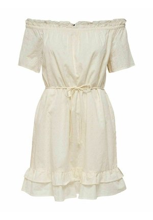 Robe crème décolletée avec broderie à œillets, manches courtes et ourlet à volants. Elle possède un lien à la taille pour un ajustement personnalisé.