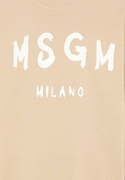 Tissu beige avec texte blanc audacieux "MSGM" et texte blanc plus petit "MILANO" imprimé en dessous.
