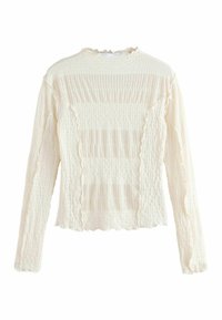 Langærmet, crèfartet sweater med tekstureret stof, der har vandrette riller og bølgede kanter. Blødere udseende med en let stræk.