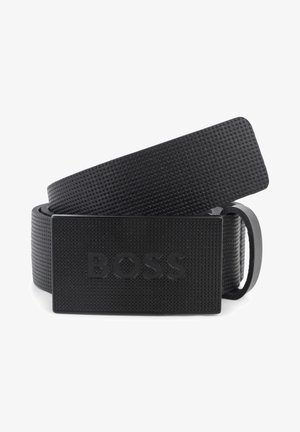 Black belt made of textured material features a solid rectangular buckle with embossed "BOSS" branding. Smooth edges, minimalist design.