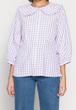 Purple and white gingham blouse with large ruffled collar, button-down front, three-quarter puff sleeves, and a fitted waist.