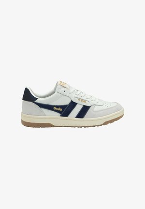 Low-top sneakers made of white leather with navy suede accents, featuring three navy stripes, perforated toe box, and a gum rubber sole.