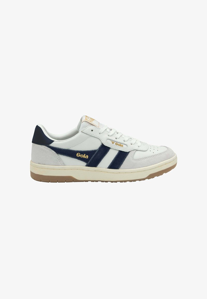 Low-top sneakers made of white leather with navy suede accents, featuring three navy stripes, perforated toe box, and a gum rubber sole.