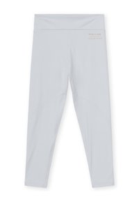 Leggings grigio chiaro con una vita alta, texture liscia e sottili dettagli di cucitura lungo le gambe. Logo stampato vicino alla vita.