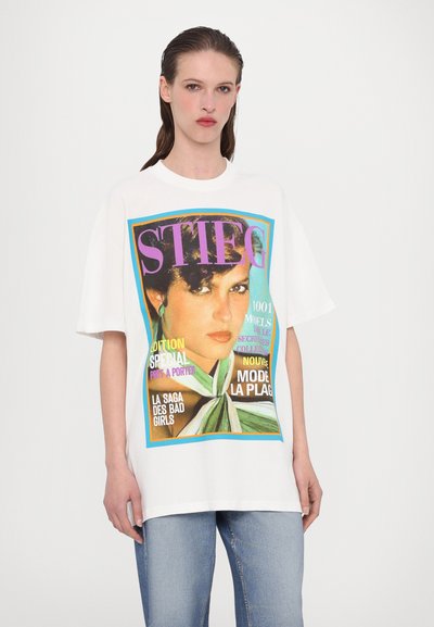 White cotton t-shirt with a colorful graphic print. features a woman's portrait and bold text in purple, blue, and yellow. Relaxed fit.