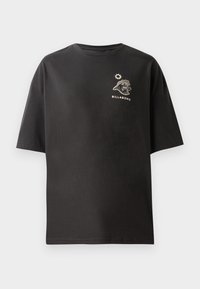 Black short-sleeve t-shirt featuring a small white Billabong logo and graphic on the chest. Made from soft cotton with a relaxed fit.