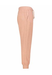 Light pink joggers made from soft fabric, featuring a drawstring waist, side pockets, and tapered cuffs. Subtle speckled texture throughout.