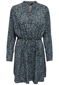 Robe à manches courtes boutonnée en tissu bleu sarcelle avec un motif à pois noirs, taille cintrée et col. Dotée d'une ceinture à nouer à la taille.