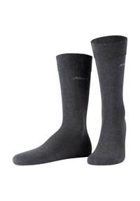 Calcetines grises hechos de un material suave y texturizado. Presentan un puño acanalado y un logo impreso en plata en el lado.
