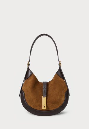 Brown suede handbag with dark leather accents, curved shape, flat handle, and a gold hardware clasp featuring a logo detail at the front.