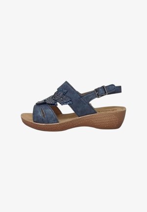 Sandal blu in suede con punta aperta, design a intaglio, fiocco decorativo e strass. Dotato di cinturino alla caviglia regolabile e suola marrone texture.