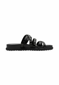 Black sandal with three overlapping straps, studded accents, a flat sole, and a textured rubber bottom for grip.