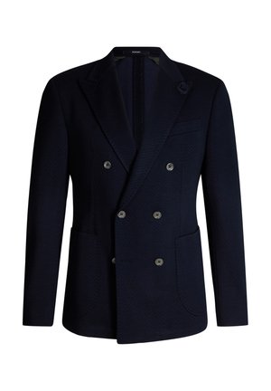 Granatowa marynarka dwurzędowa o fakturze jodełki, z dwoma przednimi kieszeniami, klapami z wcięciem, sześcioma guzikami oraz kwiatowym zdobieniem na klapie.