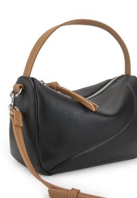 Black leather handbag featuring a unique curved design, tan leather accents, a silver zipper, and an adjustable shoulder strap.