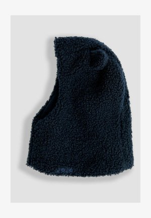 Námořnická modrá fleecová čepice s měkkým, texturovaným povrchem. Disponuje zaoblenými ušima a těsným střihem, navržena pro teplo a pohodlí.