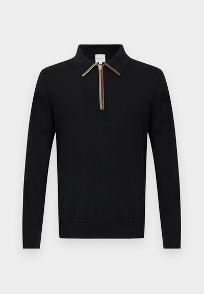 Polo en maille à manches longues noir avec demi-fermeture éclair et bordure de col à rayures arc-en-ciel, poignets et taille côtelés.