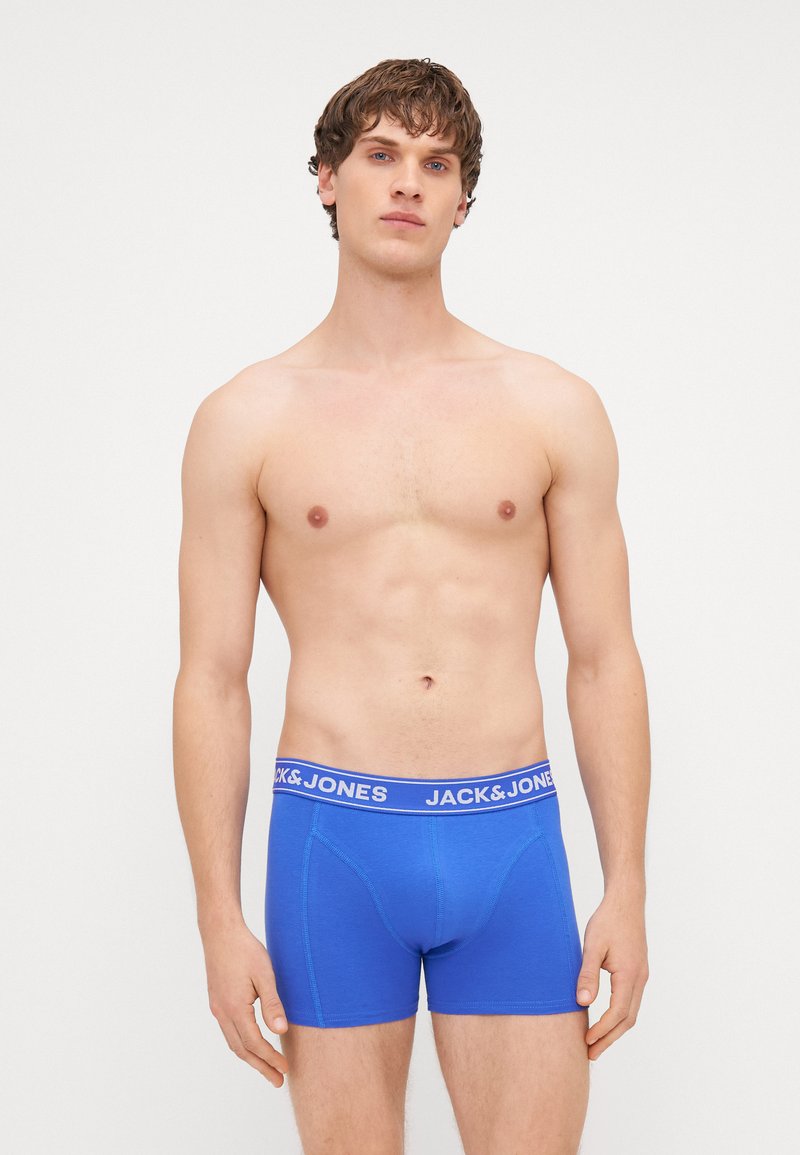 Boxer a slip blu in tessuto elasticizzato, con un design attillato e una morbida cintura con il logo "JACK & JONES" in bianco.