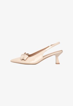 Beige patent leather slingback heels with a pointed toe and a bow accent. Features a low, geometric block heel and an open side design.