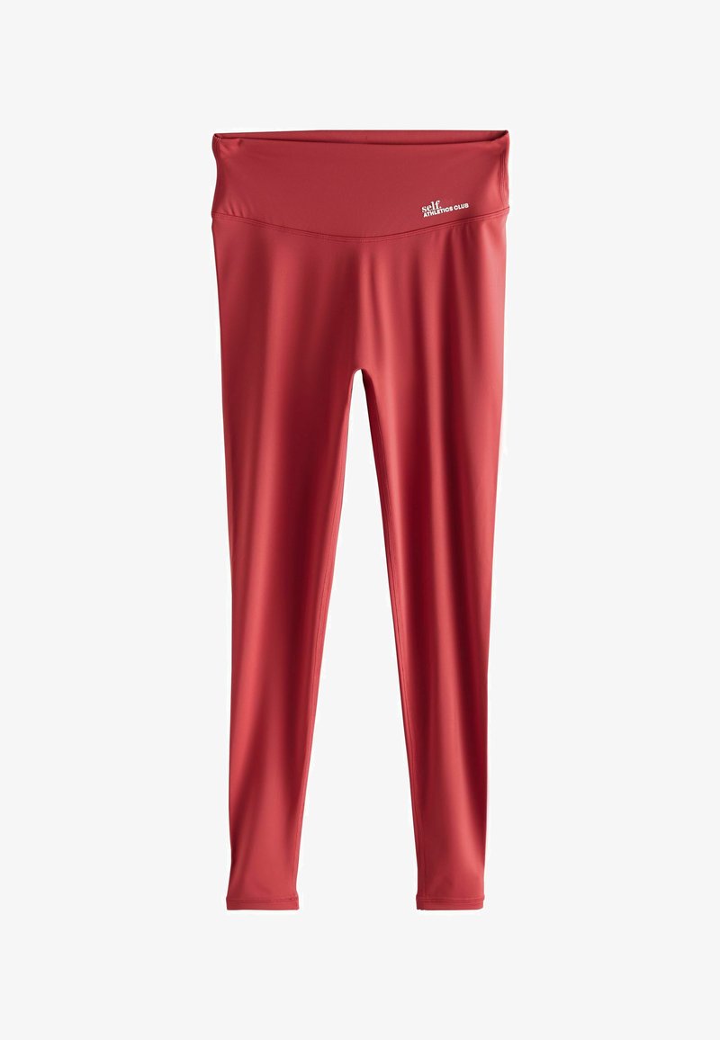 Red athletic leggings with a high waistband. Made from smooth, stretchy material with a fitted silhouette. Features subtle logo detailing.