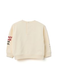 Sudadera de manga larga color crema para toddlers con puños y dobladillo acanalados, cierre a presión en la parte posterior del cuello y texto colorido en las mangas.