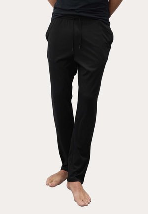 Schwarze Sporthosen aus einem weichen, leichten Stoff. Verfügt über einen elastischen Bund mit Kordelzug und Seitentaschen.