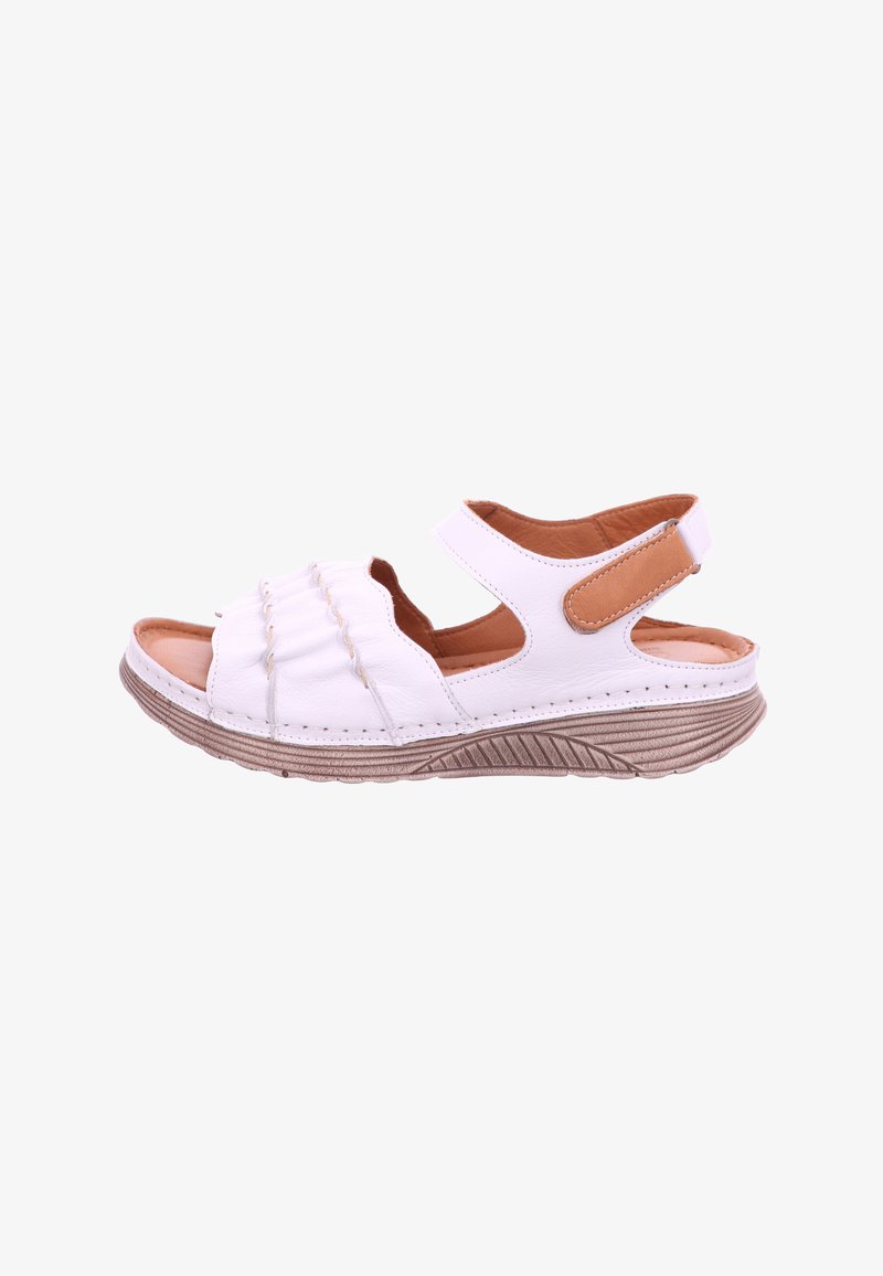 White open-toe sandal with adjustable ankle strap, brown cushioned insole, ruched front design, and textured beige sole.