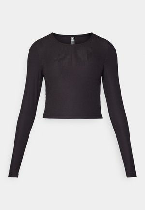 Crna dugački rukav cropped majica izrađena od rebrastog materijala. Ima okrugli izrez i usku siluetu s teksturiranom površinom.