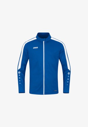 Giacca sportiva blu in tessuto liscio; presenta strisce bianche, colletto alto e dettagli con bottoni sulle maniche; chiusura a zip sul davanti.