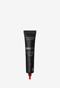 Tube de packaging noir avec des accents rouges, portant le texte "CRÈME DE SECOURS POUR LES YEUX ANTI-FATIGUE INTELLIGENTE" et un embout pointu pour une application précise.