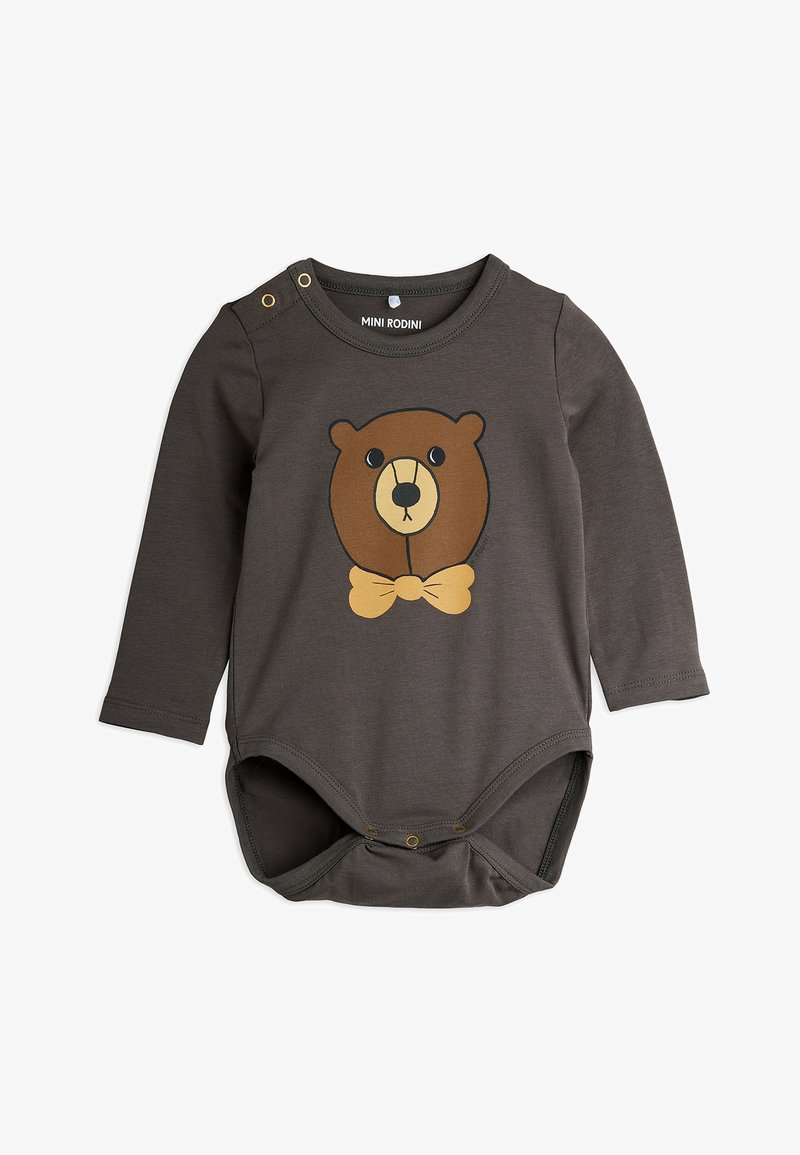 Hosszú ujjú sötétszürke babaruha, medvearc mintával és bézs csokornyakkendővel. Sapkás záródásokkal rendelkezik a vállnál és az alján a könnyű öltözködés érdekében.