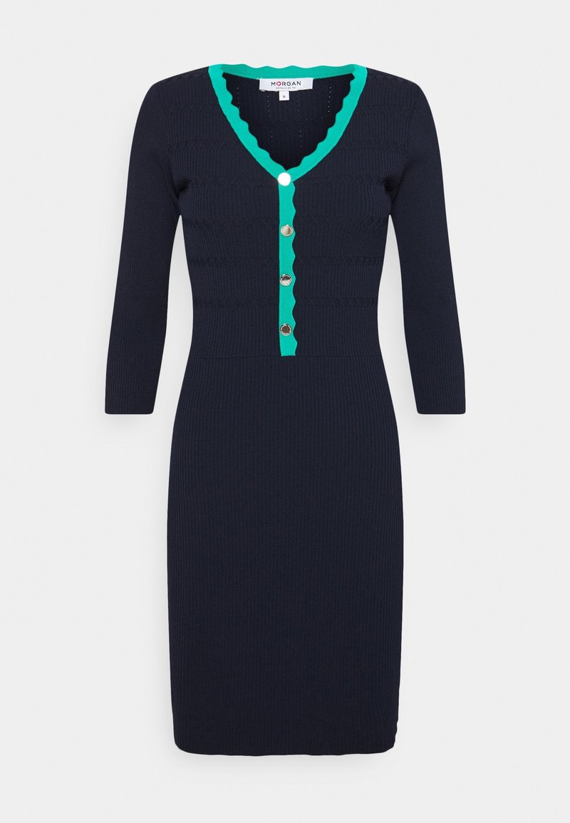 Robe en maille bleu marine avec un décolleté en V vert à bords festonnés, dotée d'un devant boutonné avec cinq boutons métalliques et de manches ajustées trois-quarts.