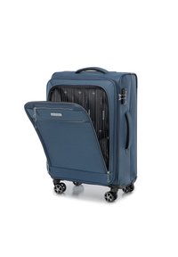 Valigia blu con un esterno in tessuto textured, un ampio scomparto con zip e quattro ruote nere per la mobilità. Interno a fantasia a contrasto.