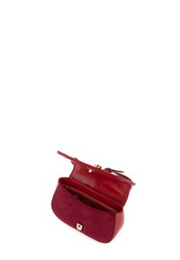 Red leather handbag with a structured shape and soft suede accents. The interior features a zippered pocket and a magnetic clasp closure.