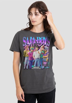 Gray cotton t-shirt featuring a colorful graphic print of anime-style characters with the text "SAJA BOYS" and branding "KPOP DEMON HUNTERS."
