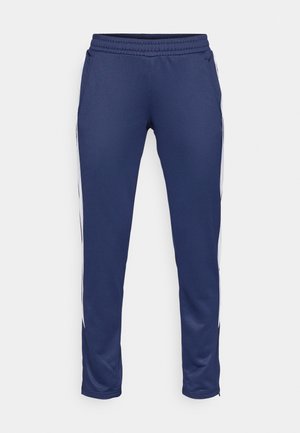 Navy athletic pants made of smooth fabric, featuring a tapered design, elastic waistband, and white side stripes. Includes two pockets.