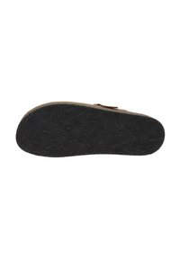 Bruine schoenzool met een gestructureerd zwart rubberpatroon dat ovale vormen en groeven voor grip bevat. Zijdelingse sluiting is zichtbaar.