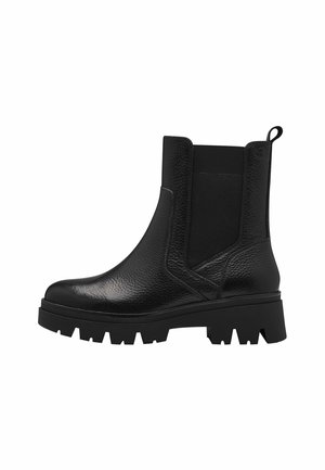 Bottines Chelsea en cuir noir avec des panneaux élastiques sur les côtés, une finition texturée et une semelle en caoutchouc épaisse avec un motif à crampons.
