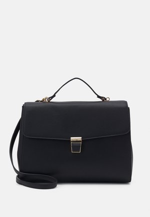 Sac à main structuré noir avec une texture lisse, une fermeture en métal doré et une bandoulière amovible. Il dispose d'une poignée supérieure et d'un design épuré.