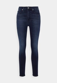 Dunkelblaue Skinny-Jeans mit einer glatten Denim-Oberfläche, hoher Taille, fünf Taschen und einem kleinen Metallschalter-Detail an der Vorderseite.